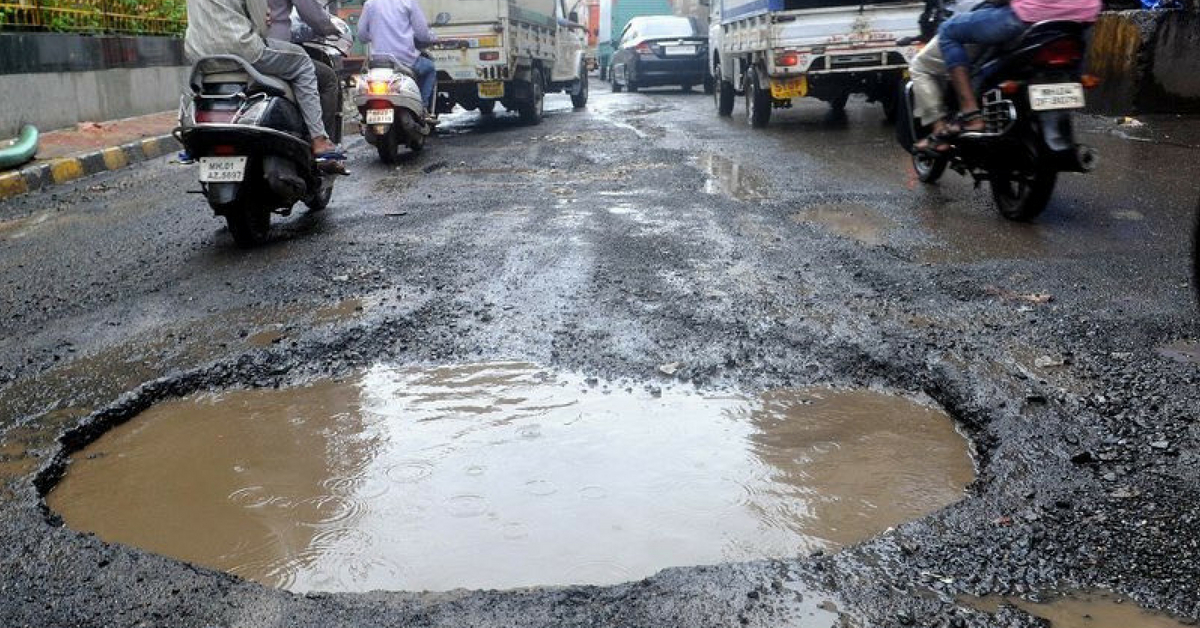 bad roads in India pothole zoom-in